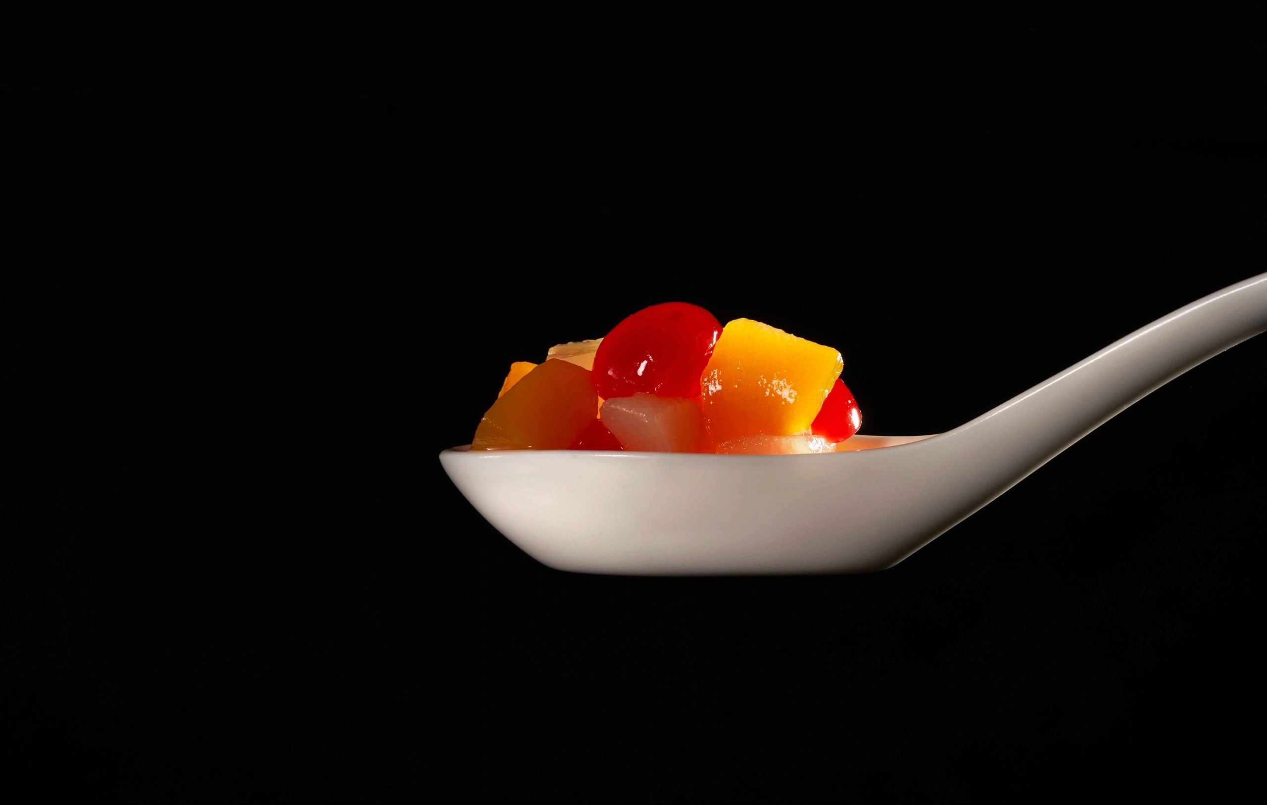 Taking a photo of the food inside the spoon with a camera